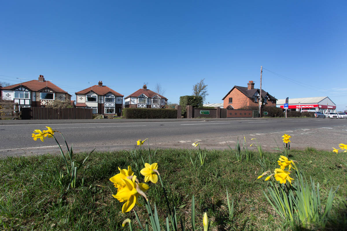 Picturesque spring view of the A41 road at Milton Green.