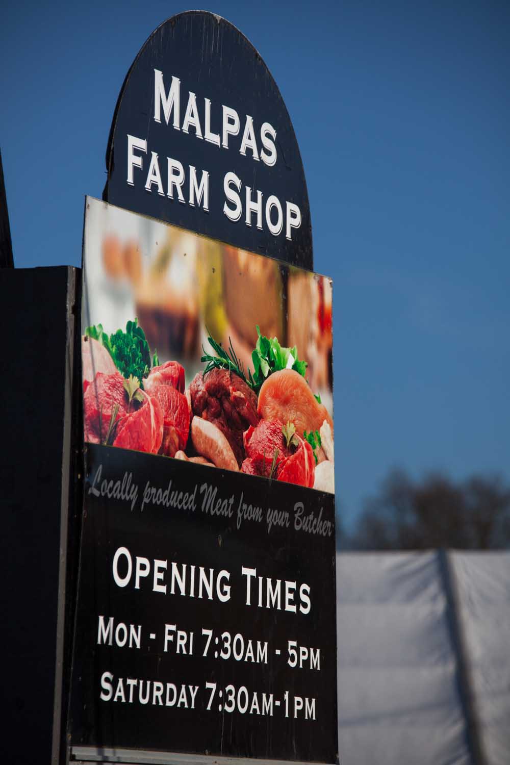 The Malpas Farm Shop sign on the B5069 in the Cheshire parish of Hampton.
