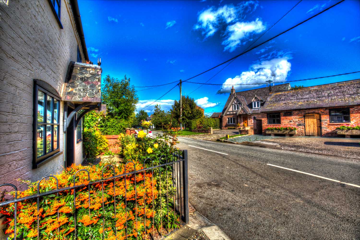 Village of Shocklach, Cheshire, England. Artistic view of the B5069 main road through the village of Shocklach.