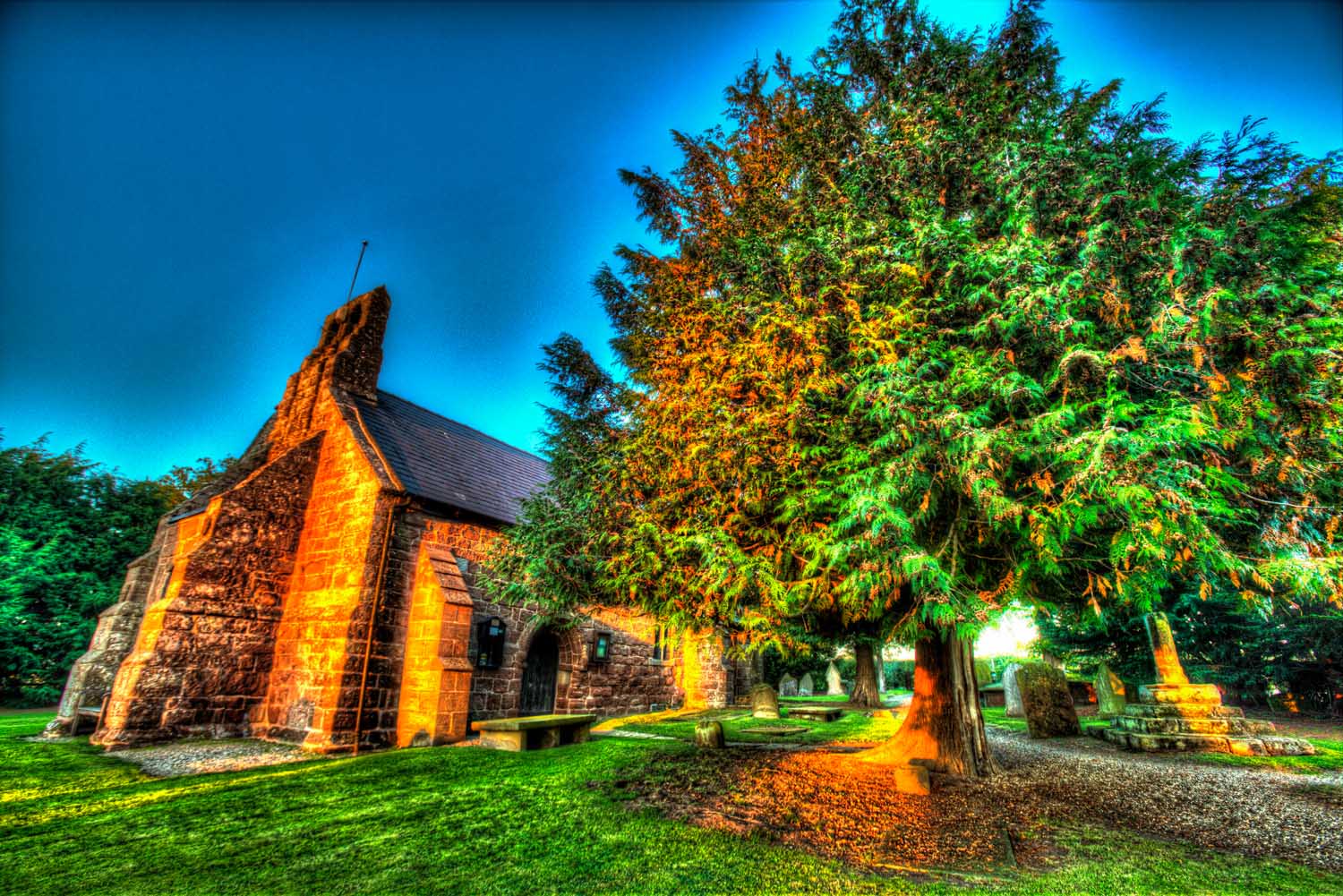 Village of Shocklach, Cheshire, England. Artistic dusk view the Grade I listed St Edith's Church. Despite many alterations, the historic 12th century structure still retains ample structural evidence of its Norman origins and there are suggestions of possible Viking connections.