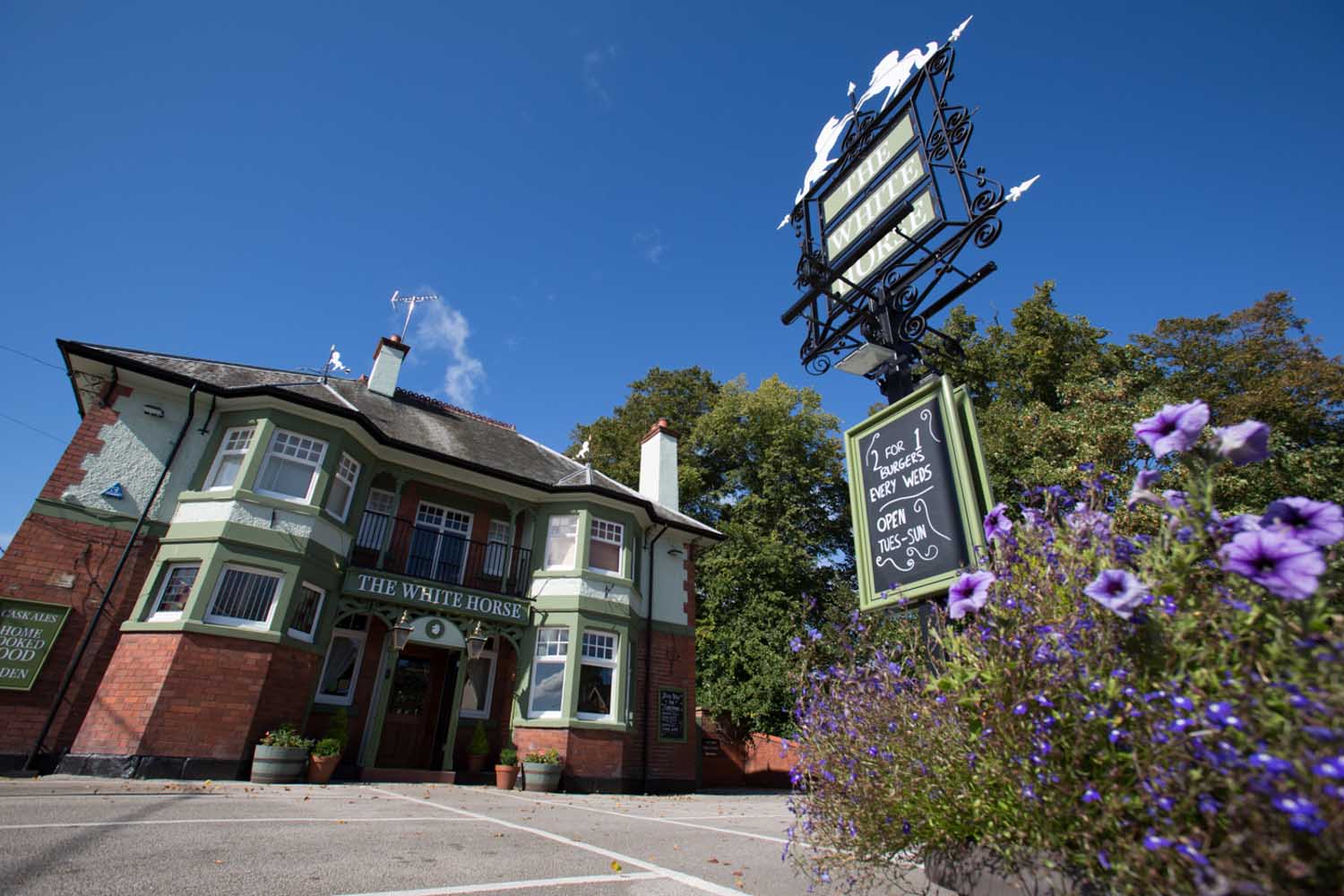 Village of Churton, Cheshire, England. Picturesque view of the White Horse village pub.