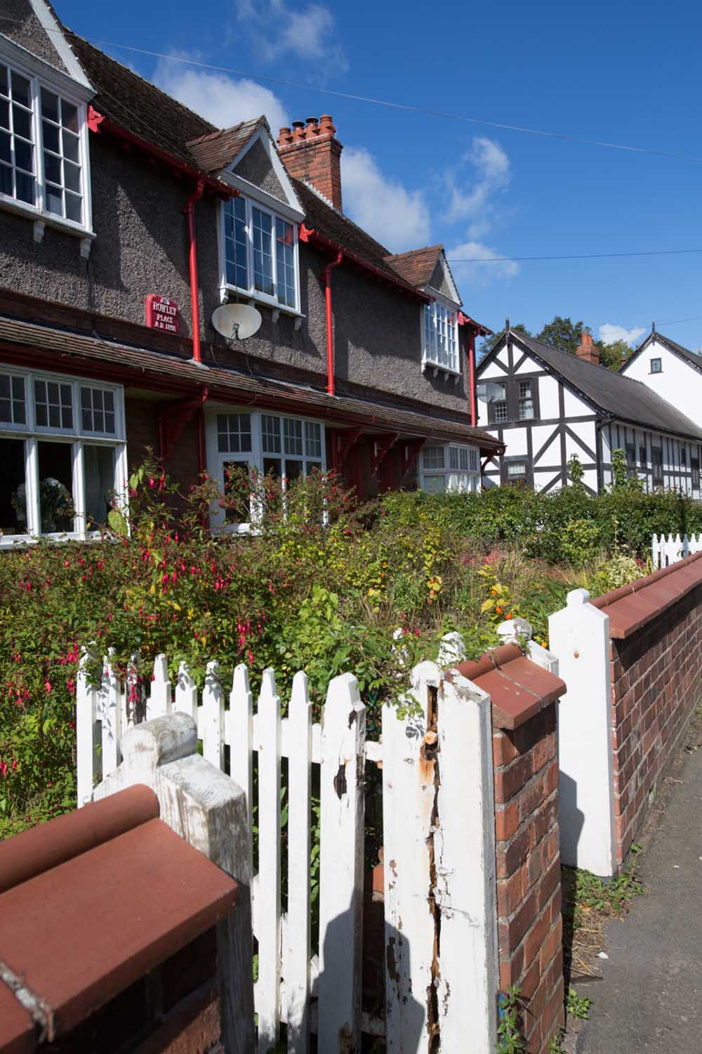 Village of Churton, Cheshire, England. Picturesque view of Victorian terraced houses on Churton’s Chester Road.